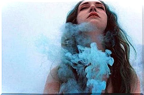 woman with blue smoke