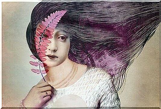 Woman with pink leaves on her face.