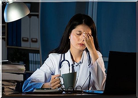 exhausted doctor drinking coffee