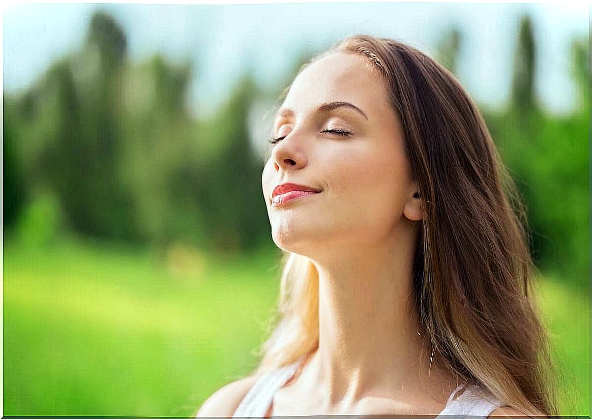 woman breathing outdoors