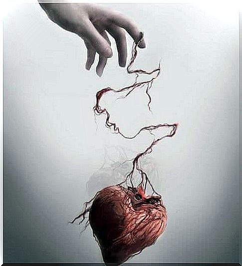 hand holding abused heart