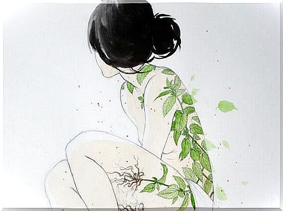 Woman with green leaves on her body.