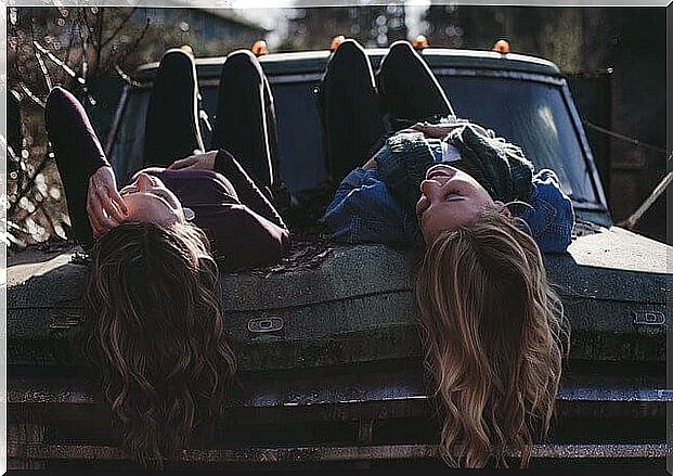 friends lying in car