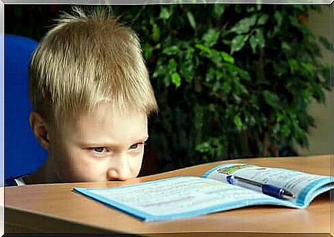 little boy concentrating on task