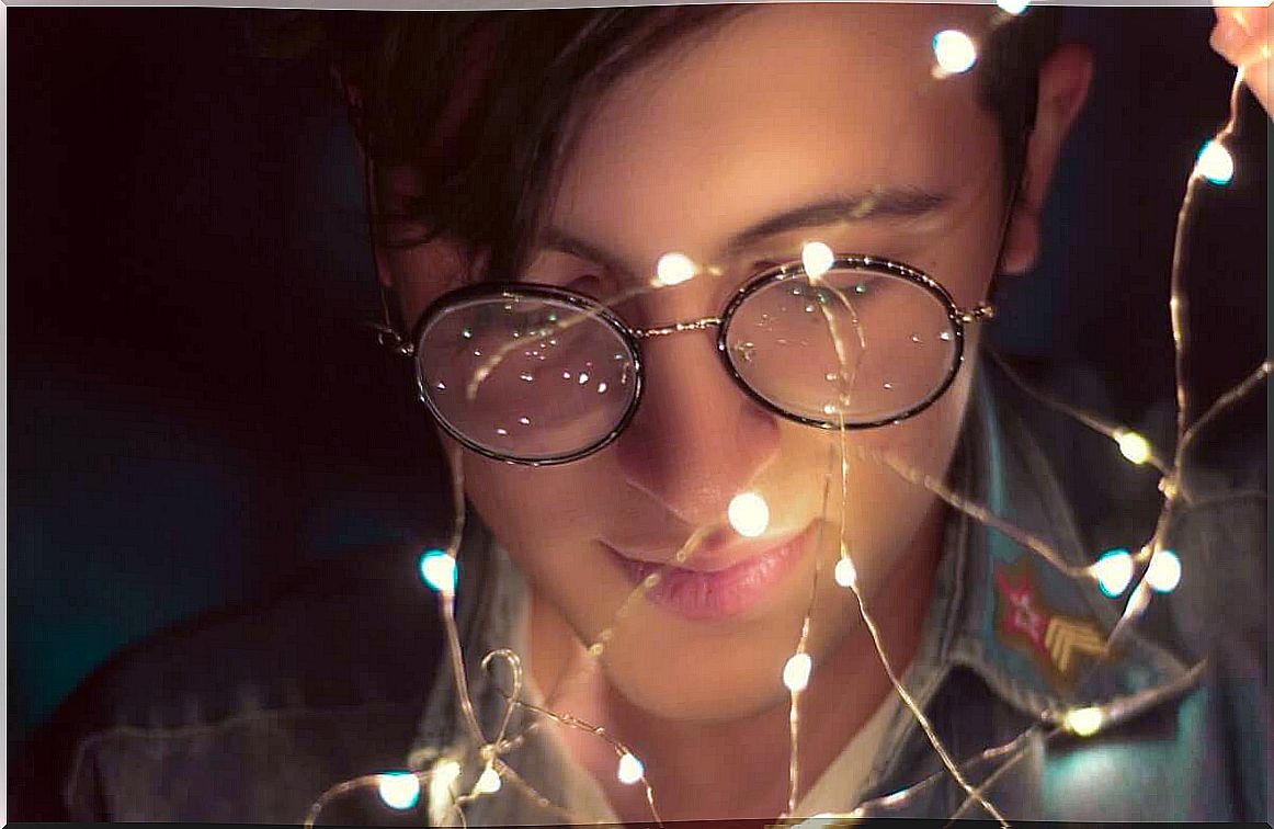 young man with glasses and lights