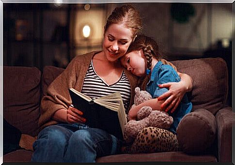 mother reading to her daughter