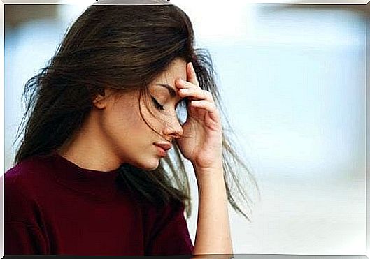 woman feeling headache